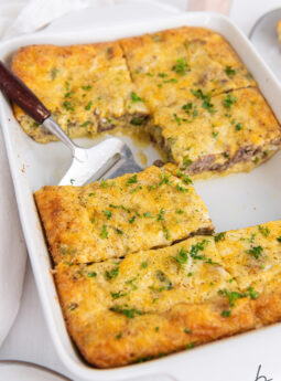 sausage breakfast casserole sliced into rectangles in a baking dish