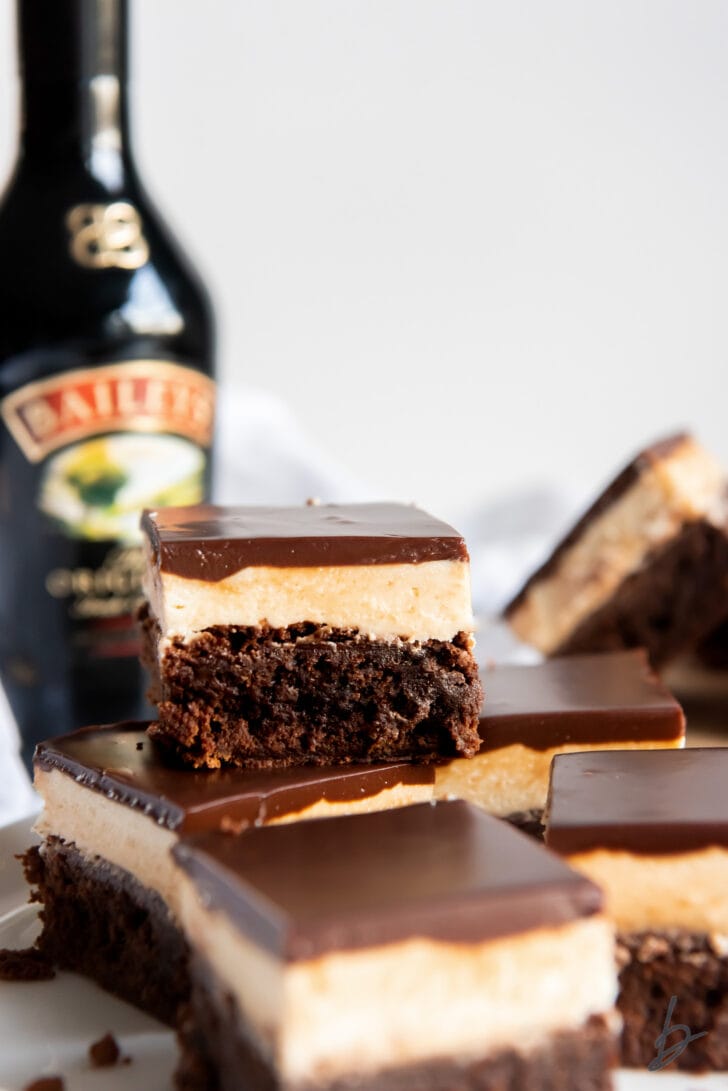 stacked baileys brownies with layers of baileys buttercream frosting and chocolate ganache