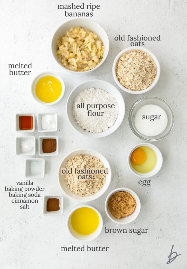 banana oatmeal muffin ingredients in bowls labeled with text