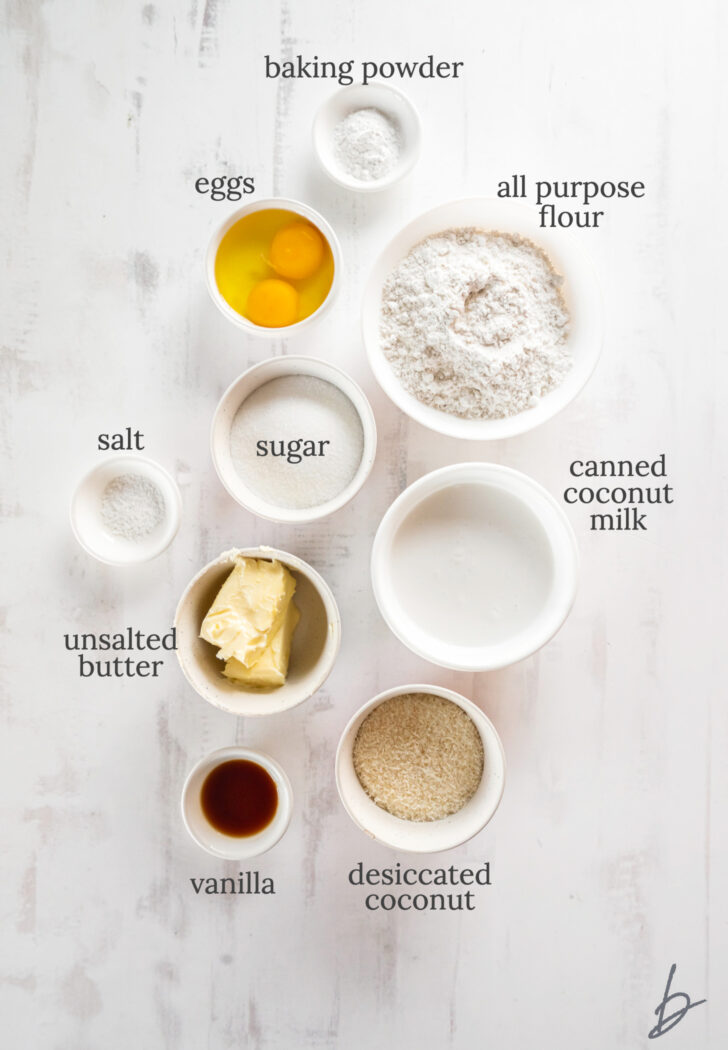 coconut cupcake ingredients in bowls labeled with text