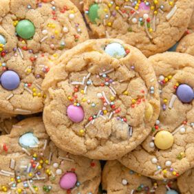 pile of easter cookies with pastel m&ms and sprinkles