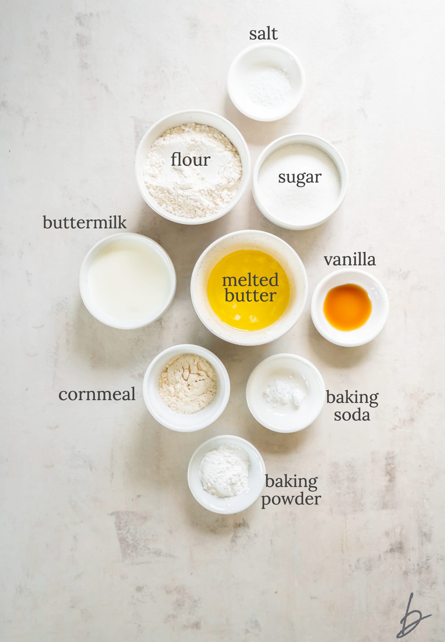 strawberry cobbler topping ingredients in bowls labeled with text