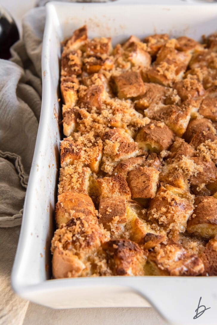 french toast casserole with brown sugar and cinnamon coated top in a baking dish