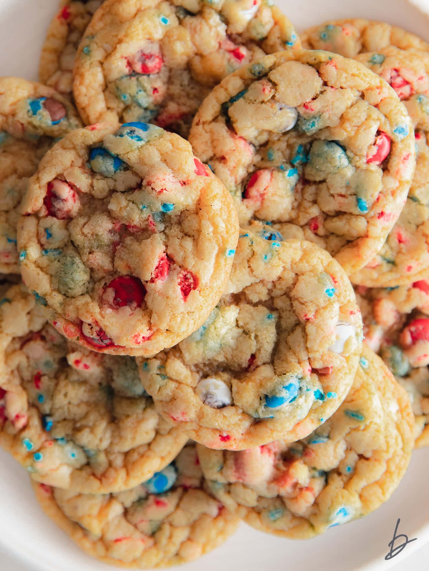 pile of cookies with red, white and blue M&Ms and sprinkles