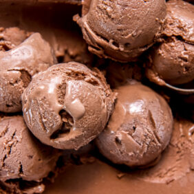 scoops of no churn chocolate ice cream on top of ice cream