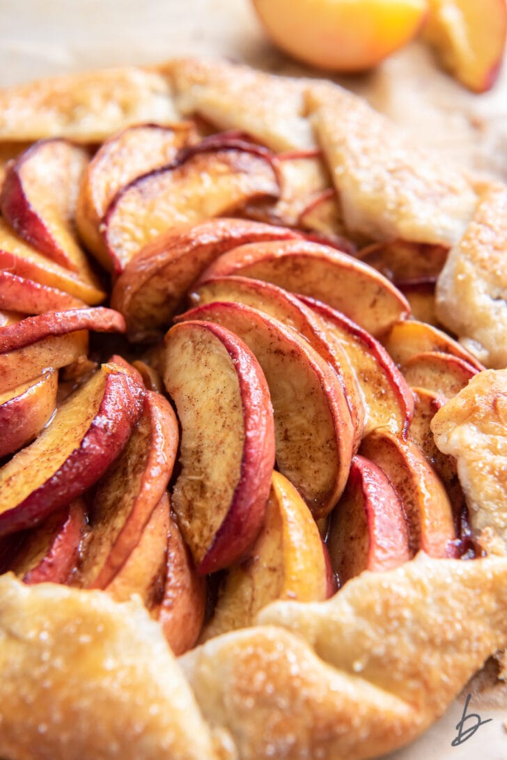 concentric peach slices inside a galette tart