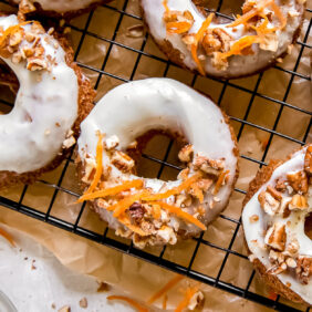 garnished carrot cake donuts with cream cheese frosting