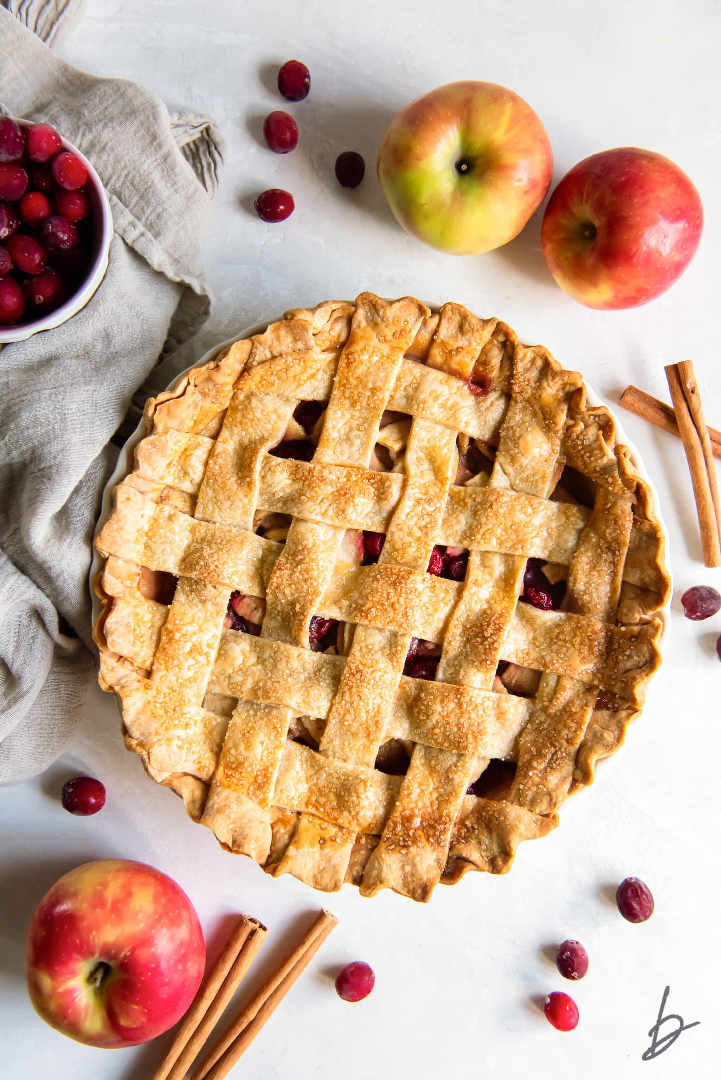 cranberry apple pie with a golden lattice pie crust.