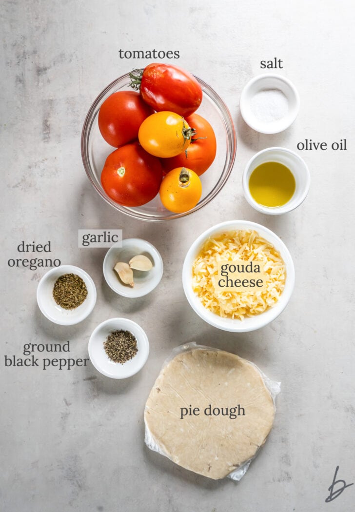 tomato galette ingredients in bowls labeled with text
