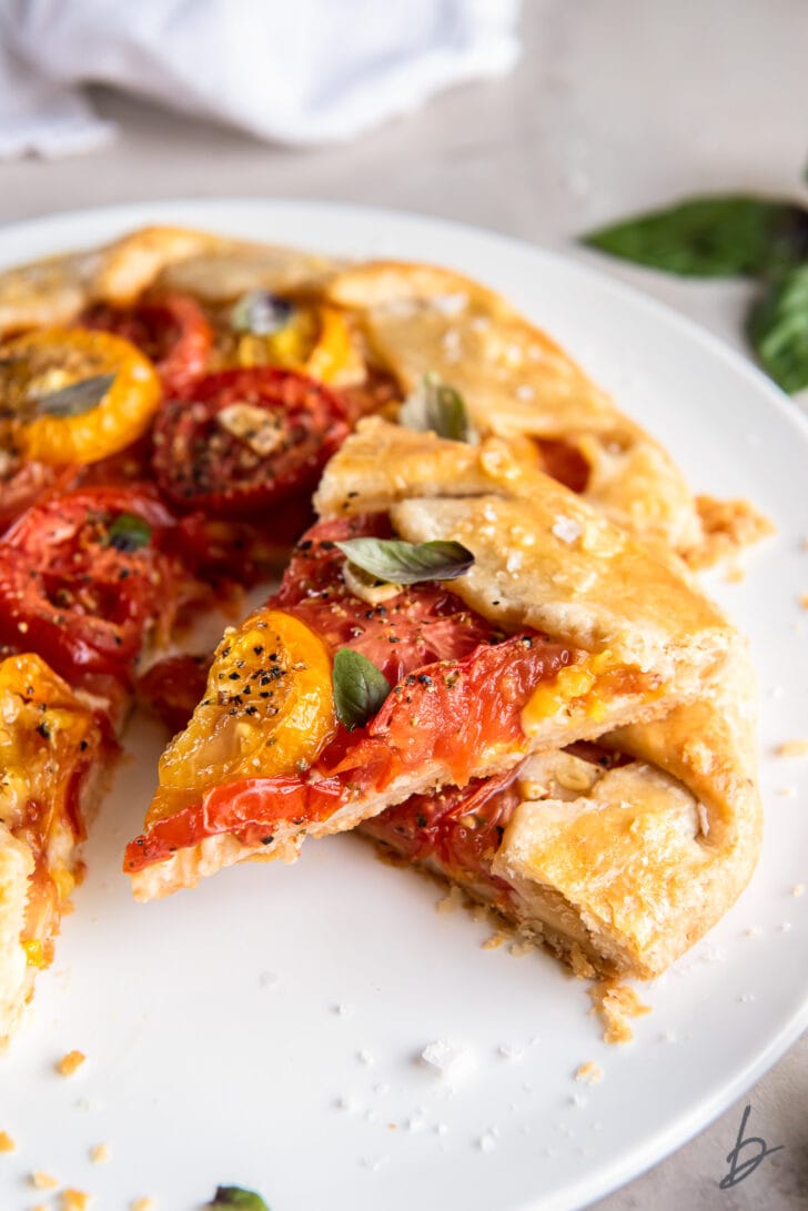 slice of tomato galette on top of the rest of the galette