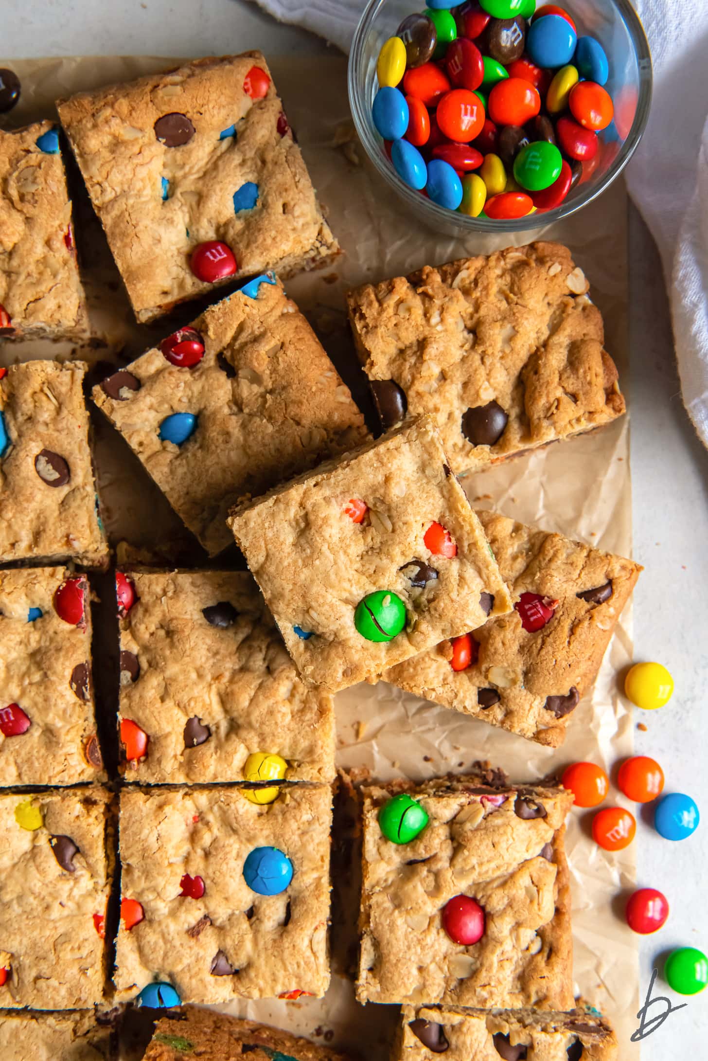 monster cookie bars with m&ms cut into squares.