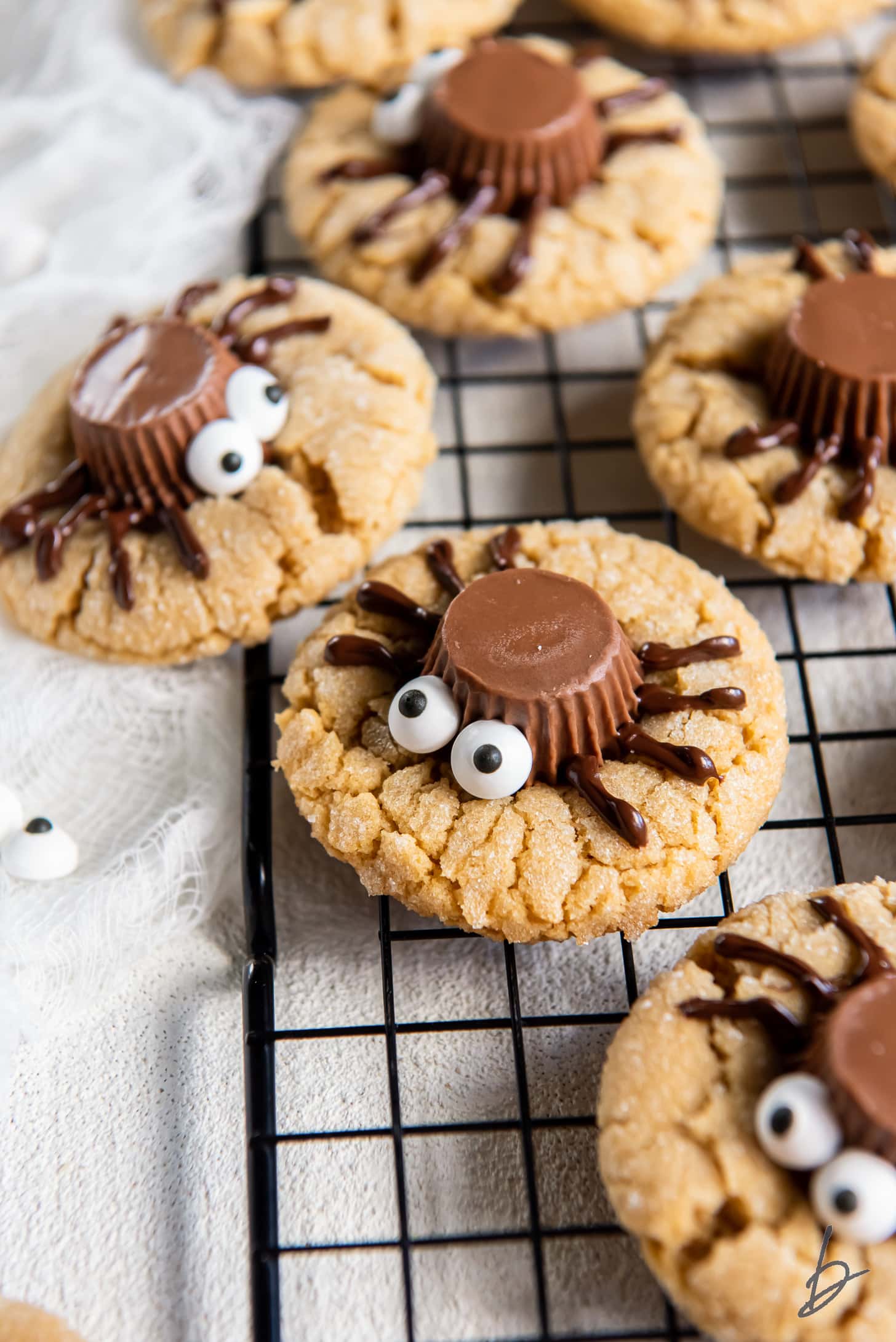 peanut butter spider cookies with candy eyes and peanut butter cups.