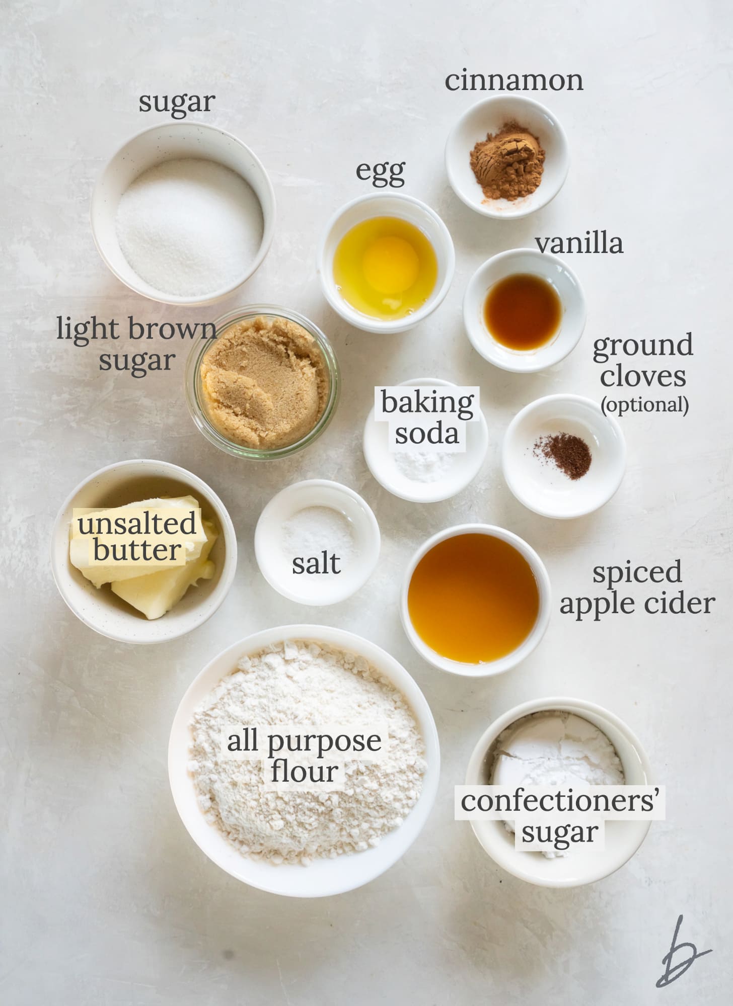 apple cider cookies ingredients in bowls labeled with text.