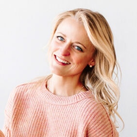 haley, blonde woman, smiling and wearing light pink sweater.