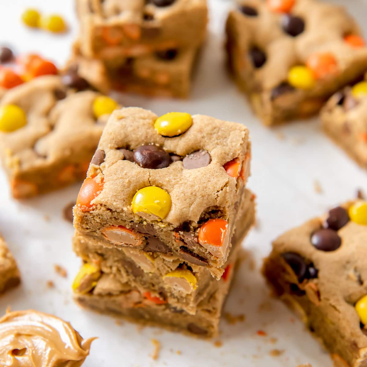 reese's pieces blondies in a stack.