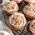 snickerdoodle cupcake with cinnamon cream cheese frosting and cookie crumbles.