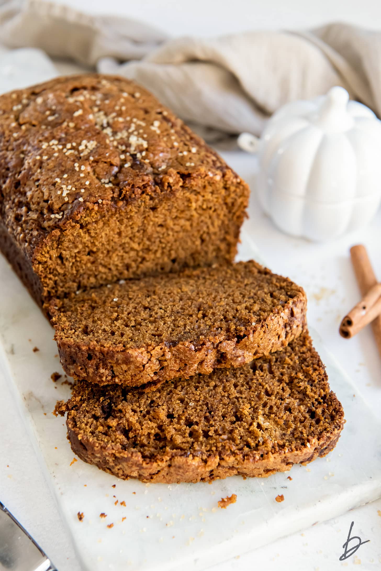 spiced pumpkin gingerbread with two slices cut off the end.