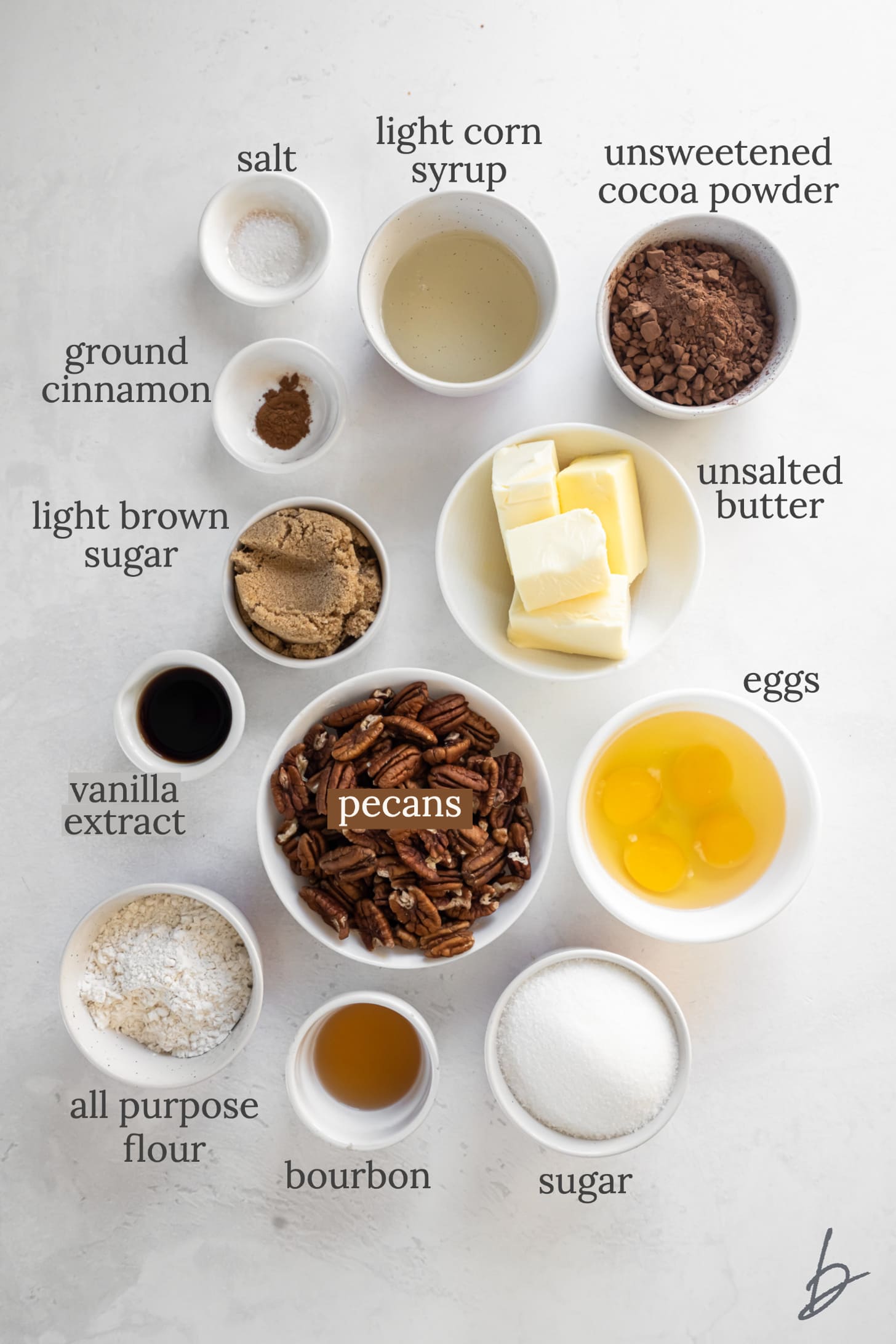 bourbon pecan pie brownie ingredients in bowls labeled with text.