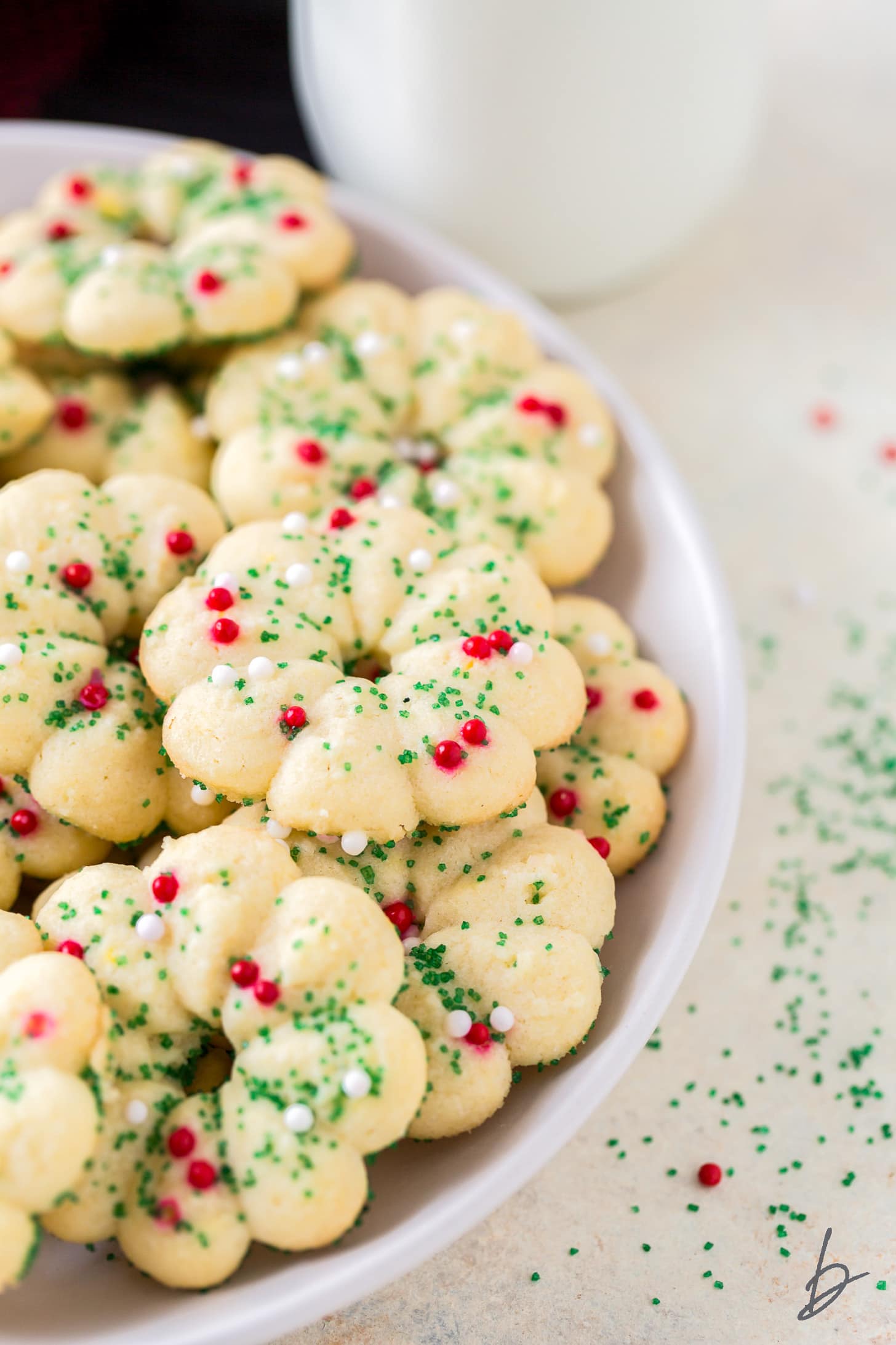 butter spritz cookies with christmas sprinkles on plate.