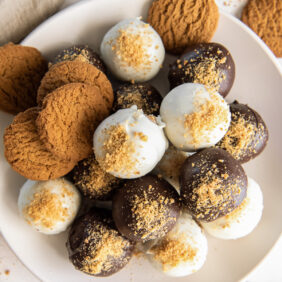 gingerbread truffles on a plate with gingerbread cookies.