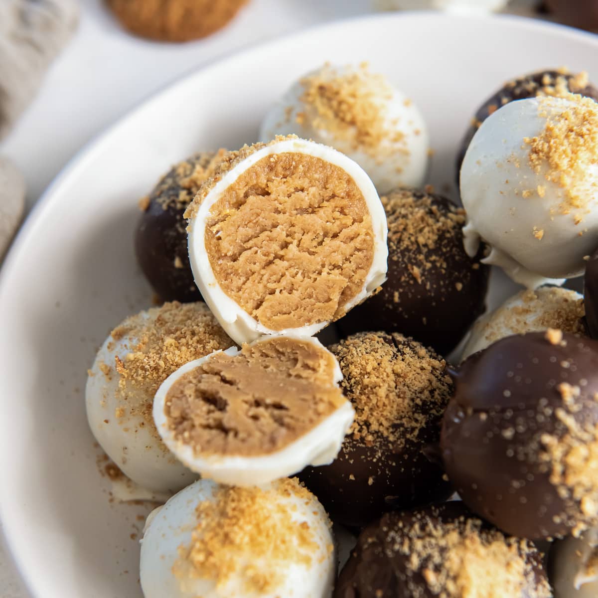 gingerbread truffle cut in half on top of more truffles.