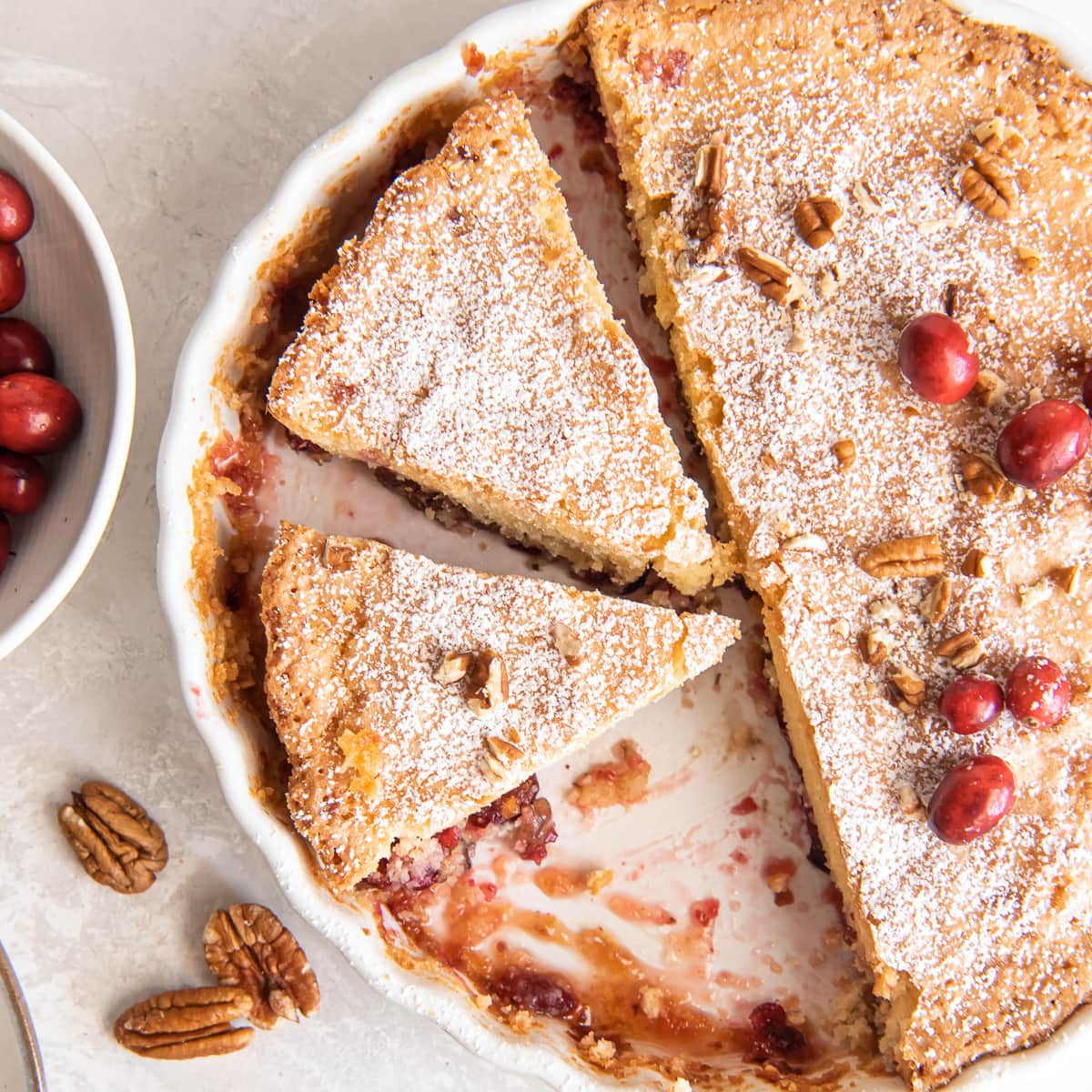 nantucket cranberry pie with two slices cut in pie dish.