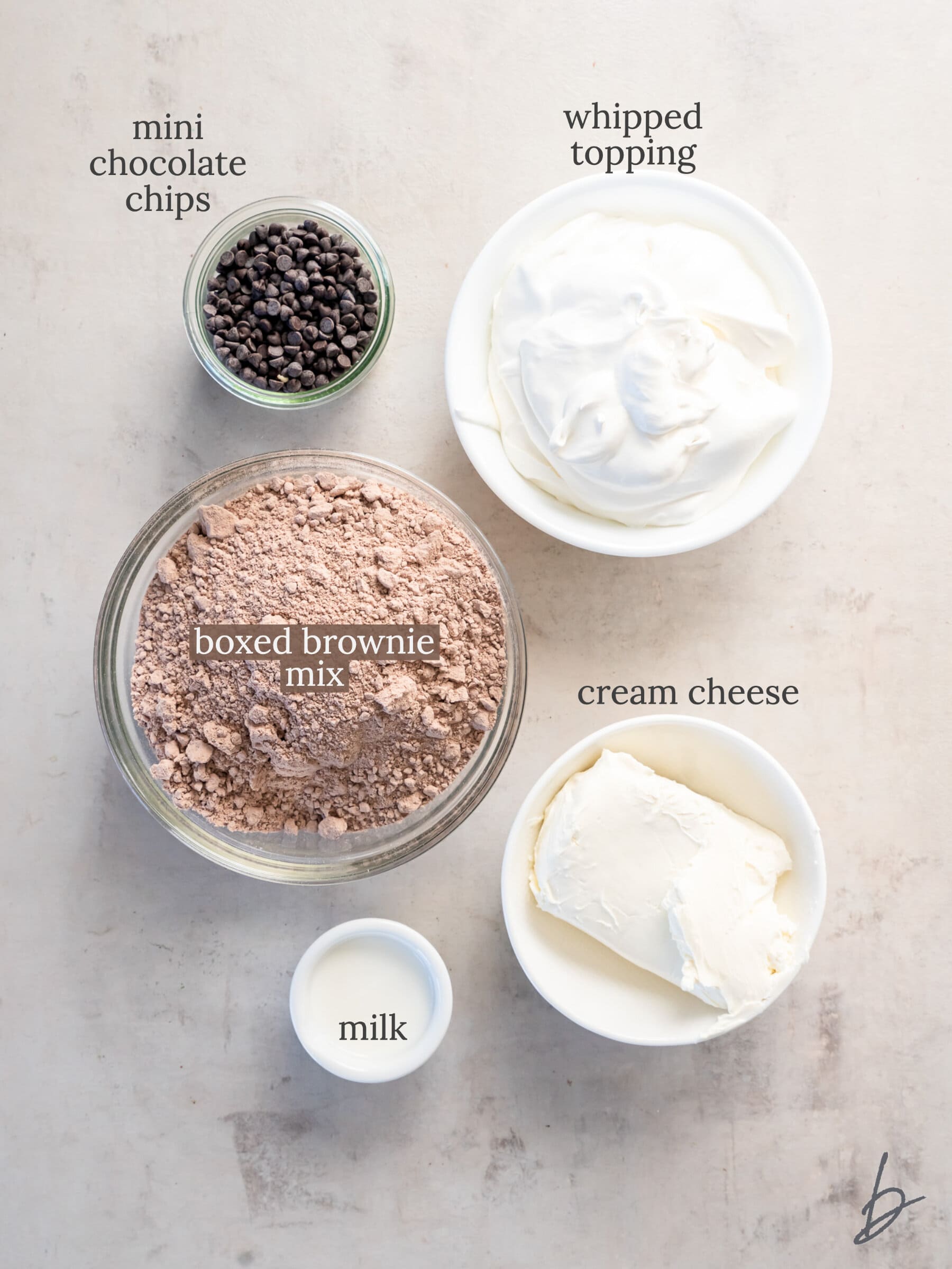 brownie batter dip ingredients in bowls labeled with text.