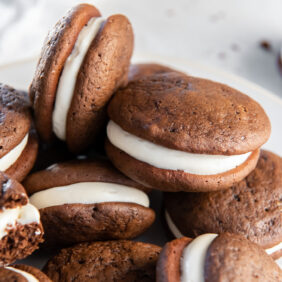pile of soft chocolate whoopie pies with cream cheese filling.
