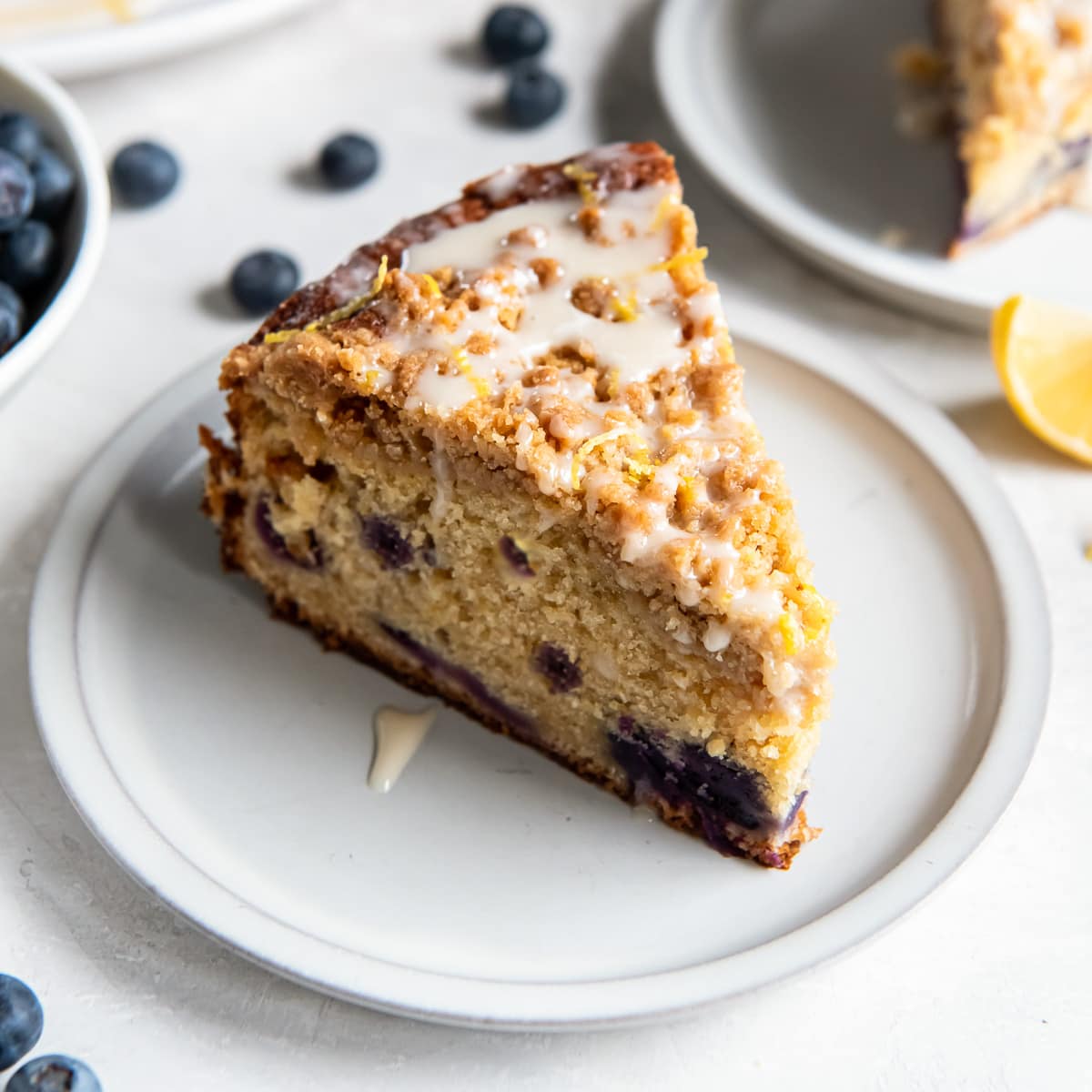 slice of blueberry buckle coffee cake on a plate.
