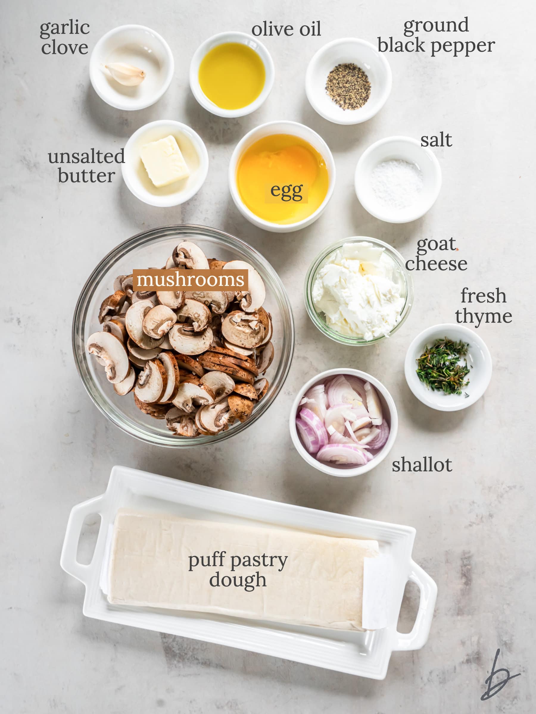 mushroom tart ingredients in bowls labeled with text.