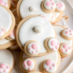 bunny butt sugar cookies decorated with icing and mini marshmallow tails.