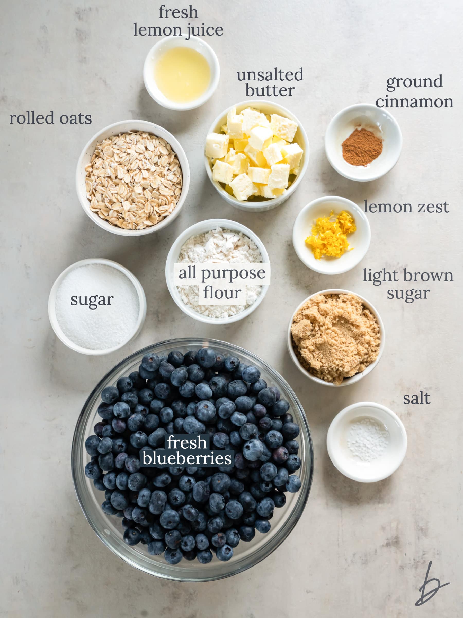 bowls of ingredients to make blueberry crisp.