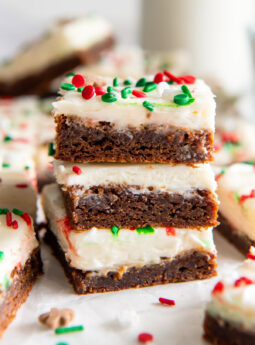 three gingerbread bars with cream cheese frosting.