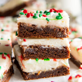 three gingerbread bars with cream cheese frosting.