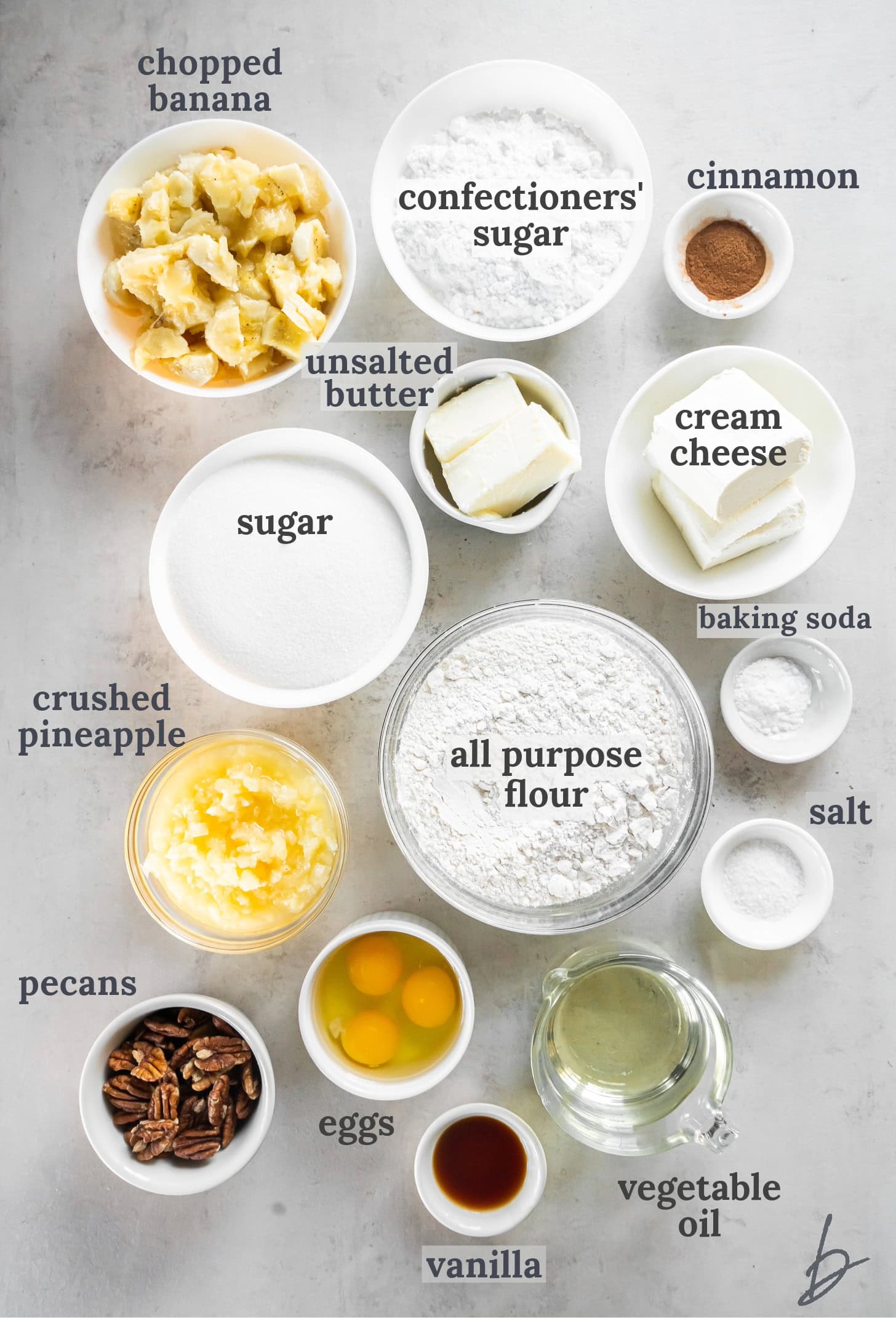 hummingbird cake ingredients in bowls on a tabletop.