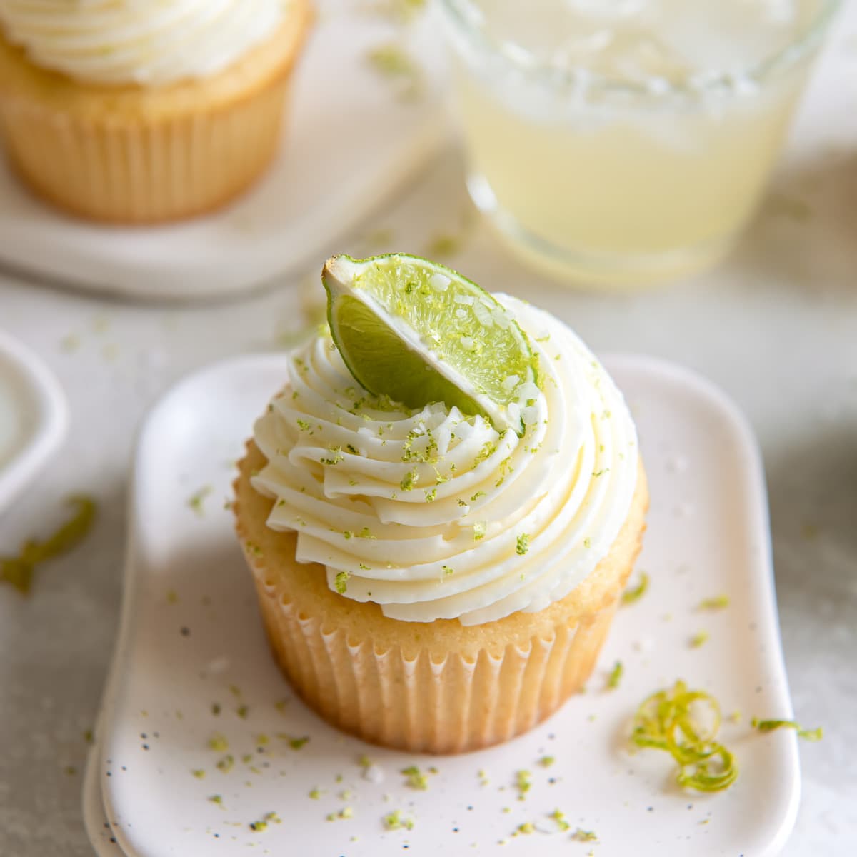 margarita cupcake with a lime wedge as garnish on tequila lime buttercream frosting.