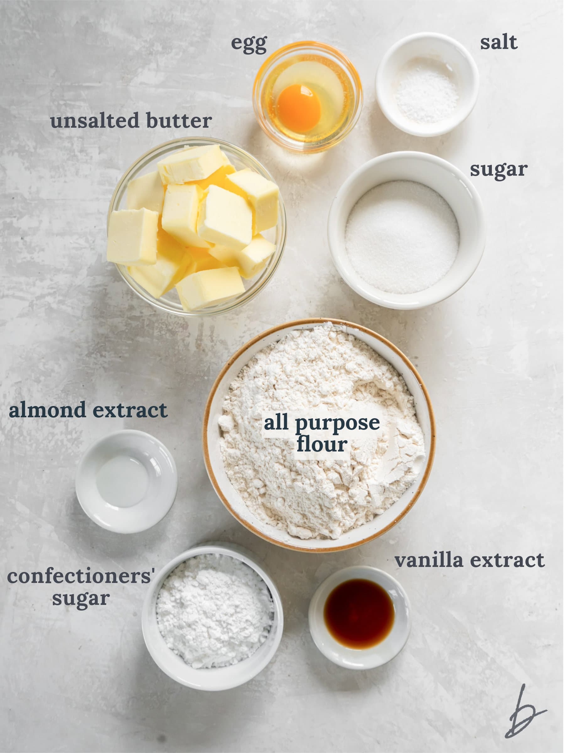 bowls of ingredients to make shortbread stamped cookies.