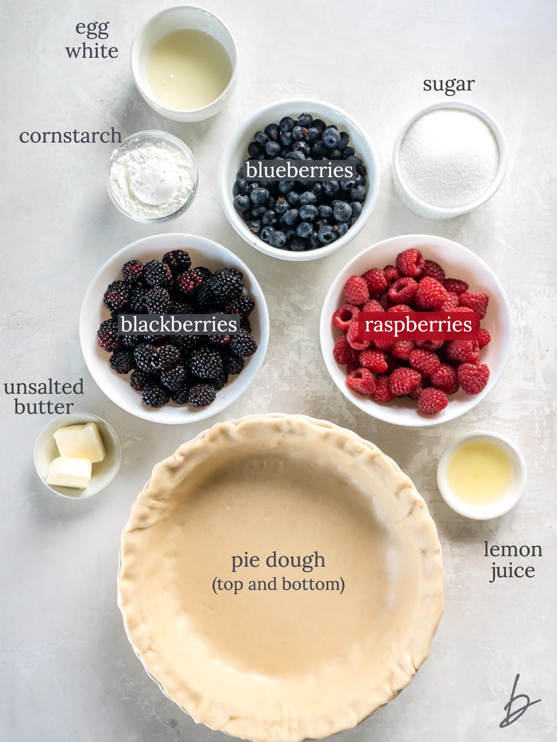 ingredients to make triple berry pie on a tabletop.
