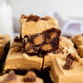 frosted peanut butter brownie with peanut butter cups inside.