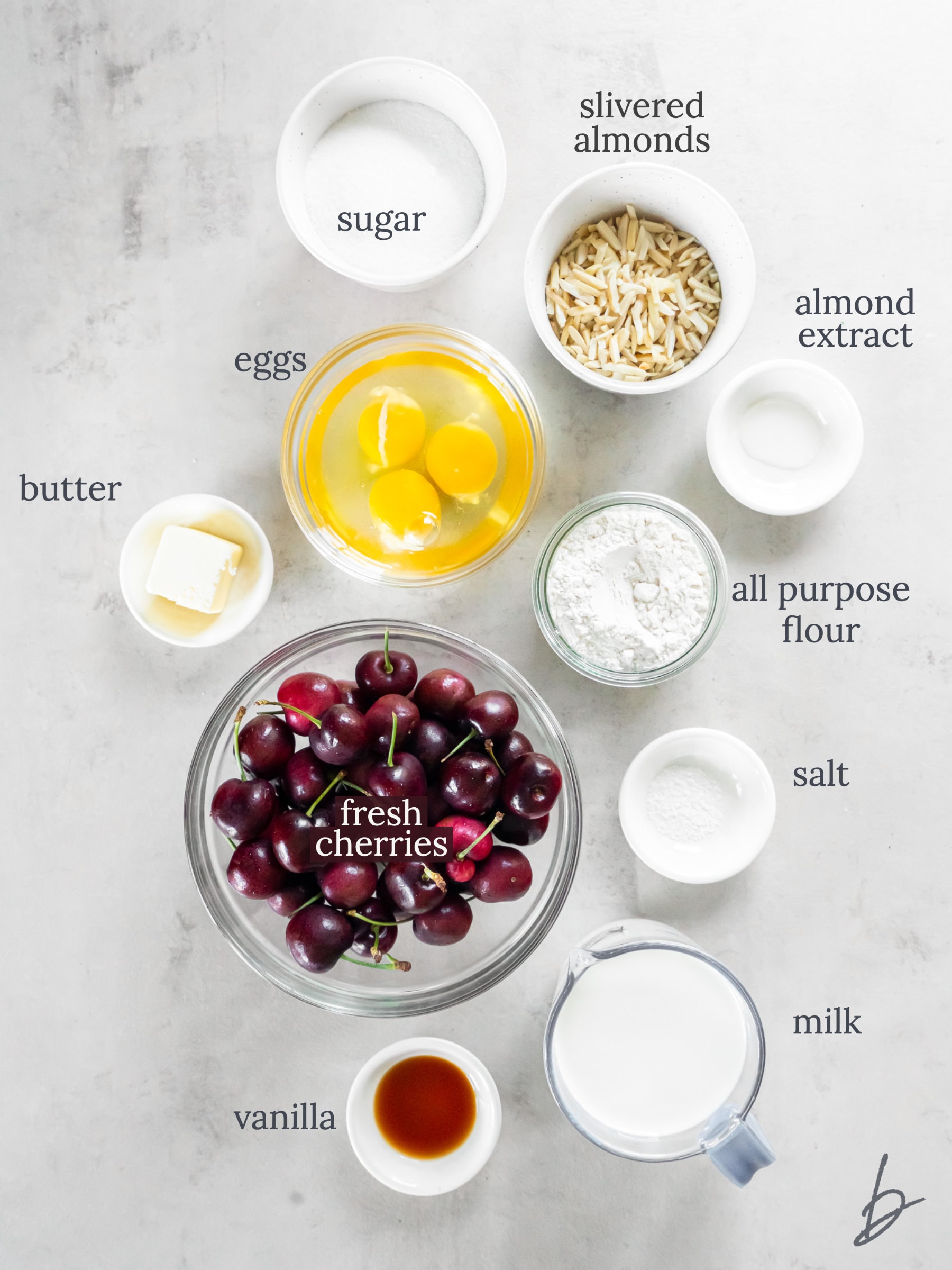 bowls of ingredients to make cherry clafoutis.