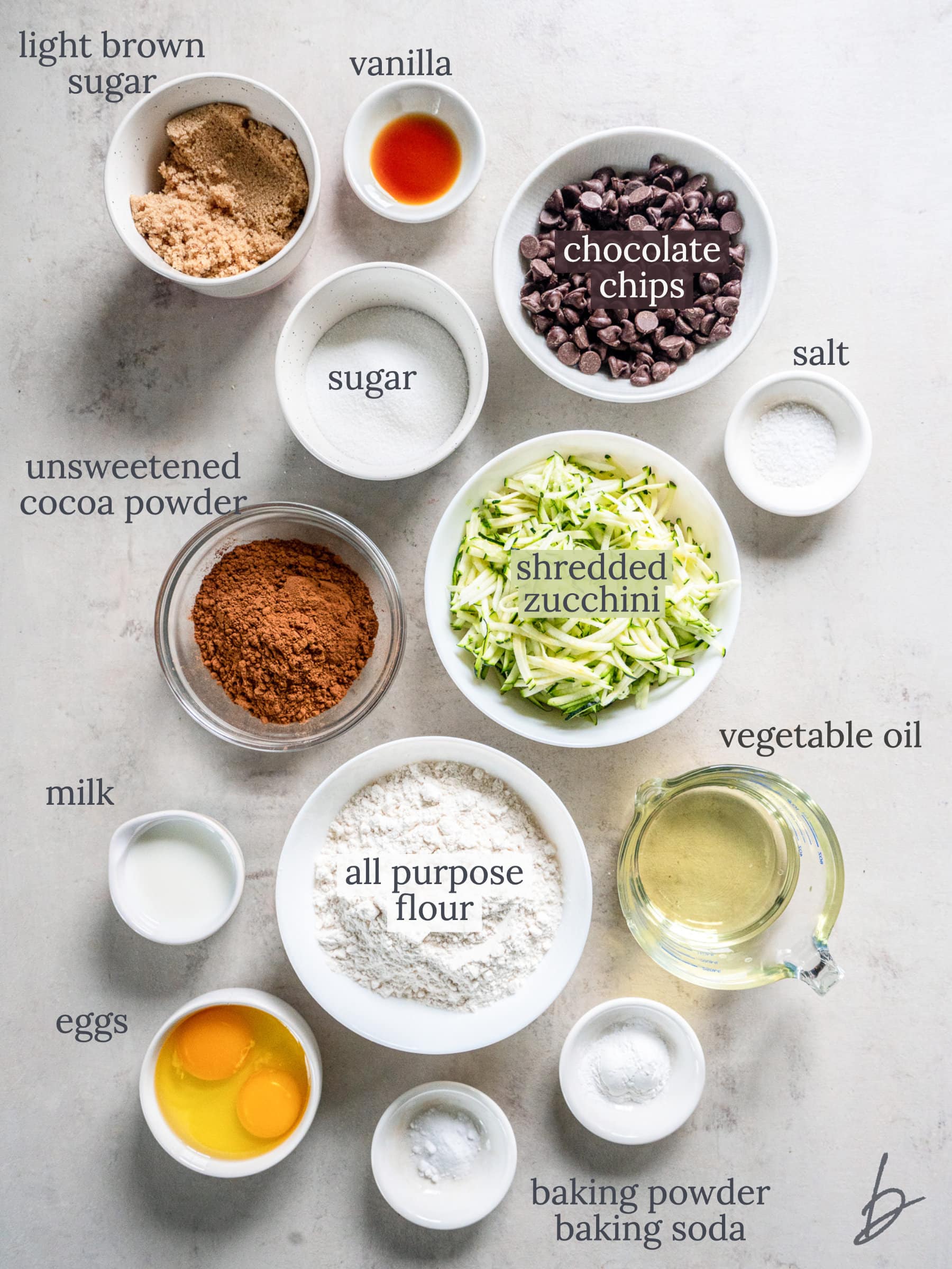bowls of ingredients to make double chocolate zucchini muffins.