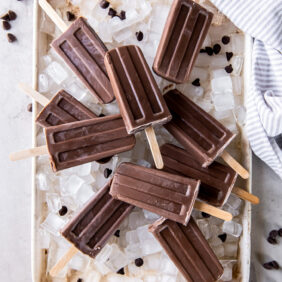 fudgesicles on a baking sheet with ice cubes.