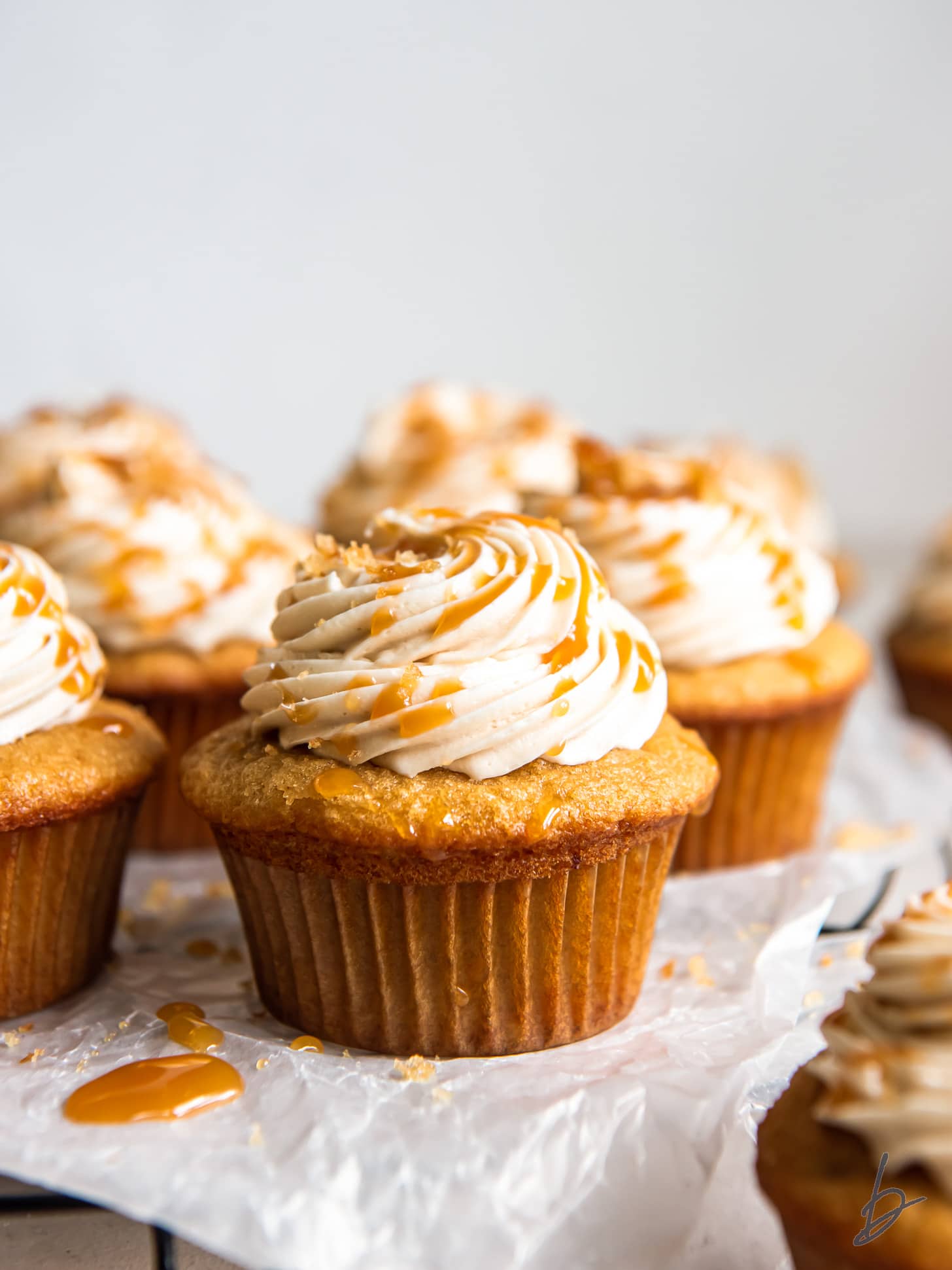 brown sugar cupcake with caramel frosting and caramel drizzle.