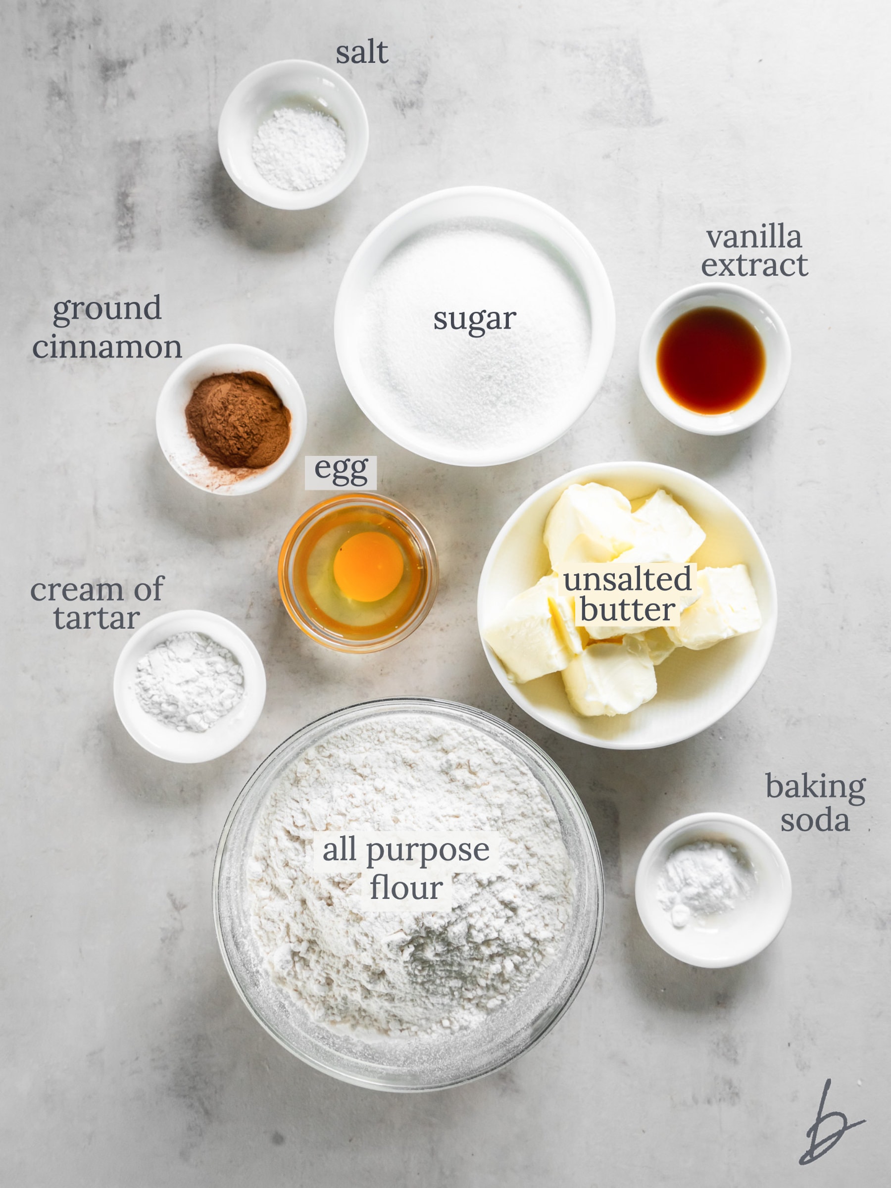 bowls of ingredients to make snickerdoodle cookies.