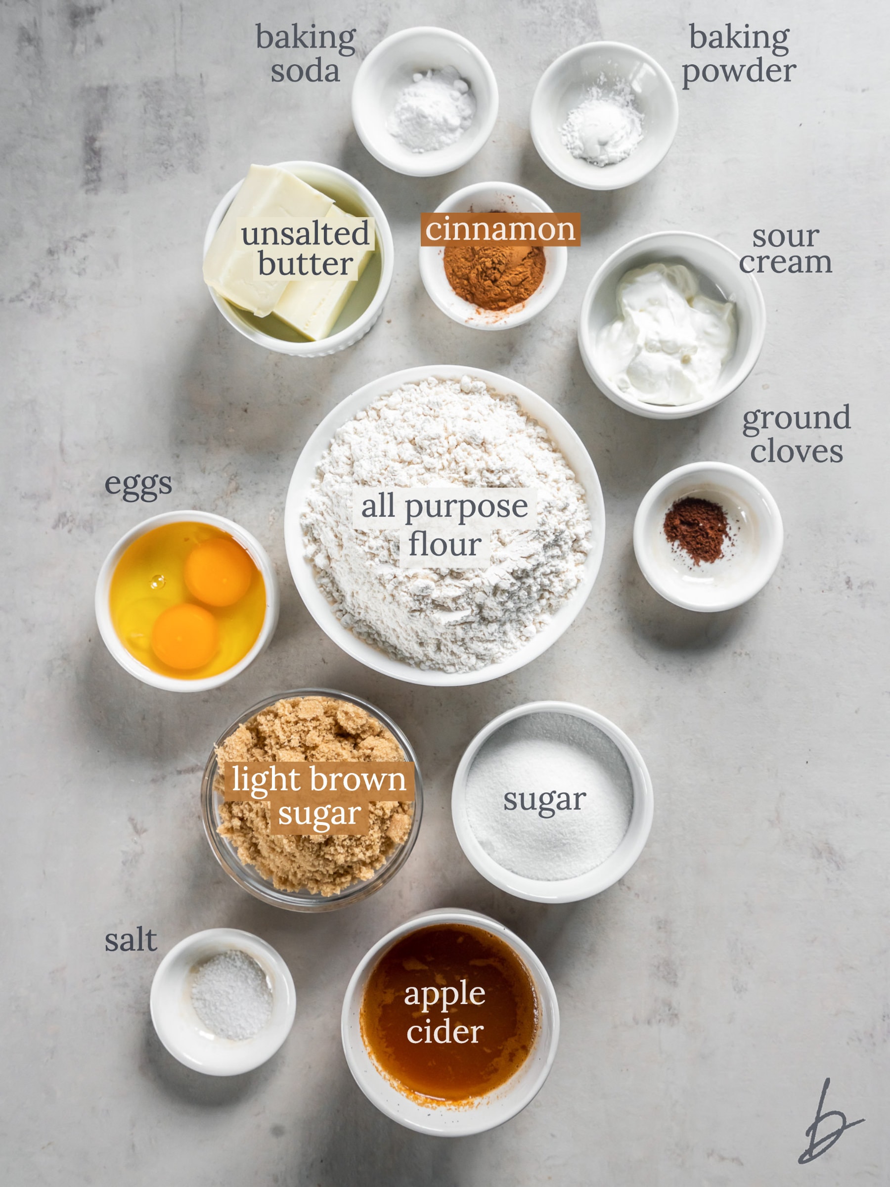 bowls of ingredients to make apple cider muffins.