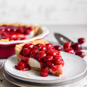 slice of cherry cream cheese pie on a plate.
