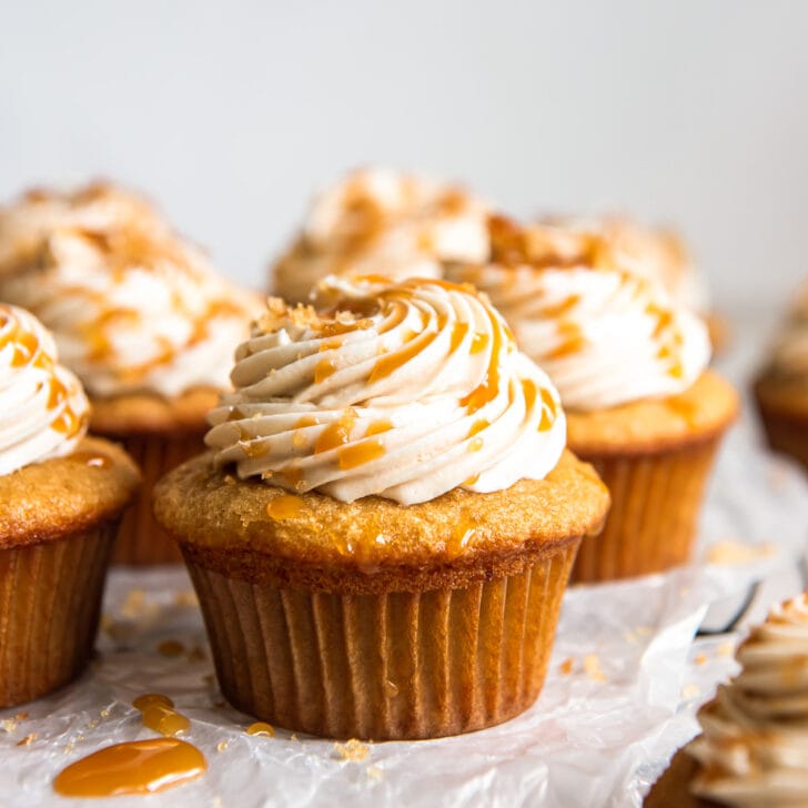 brown sugar cupcake with caramel frosting and drizzle of caramel.