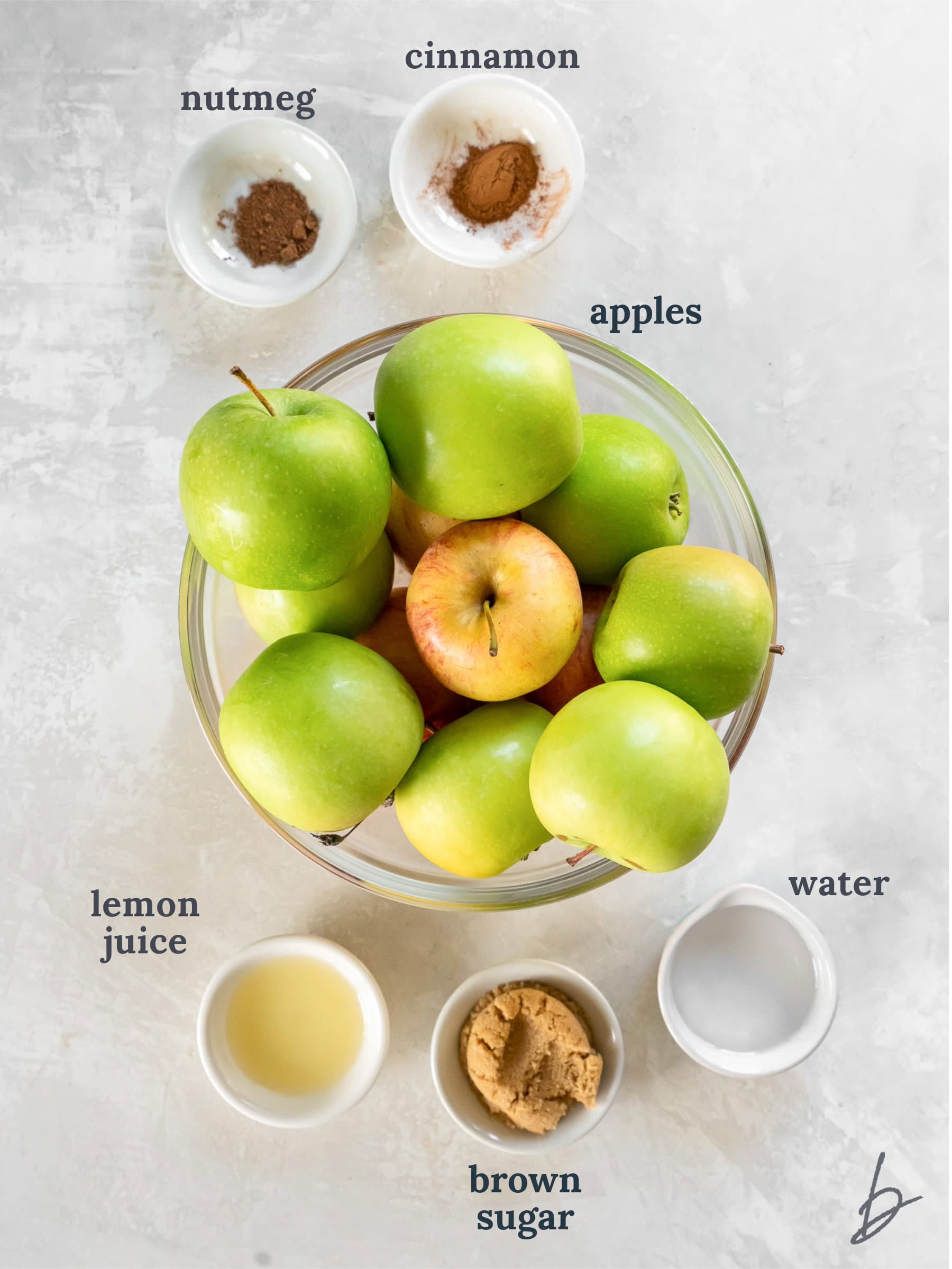 bowls of ingredients to make apple compote.