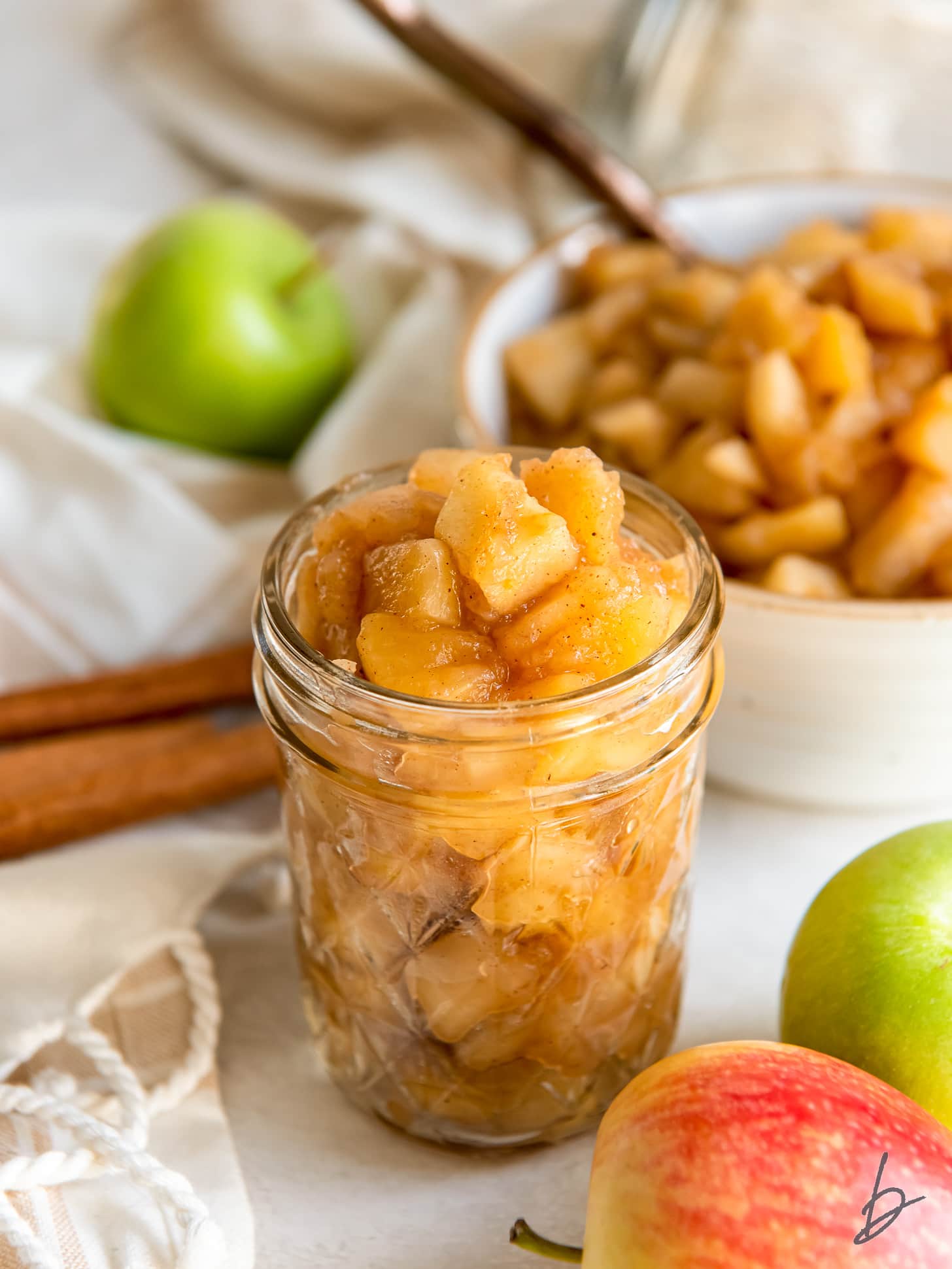 apple compote in a glass mason jar.