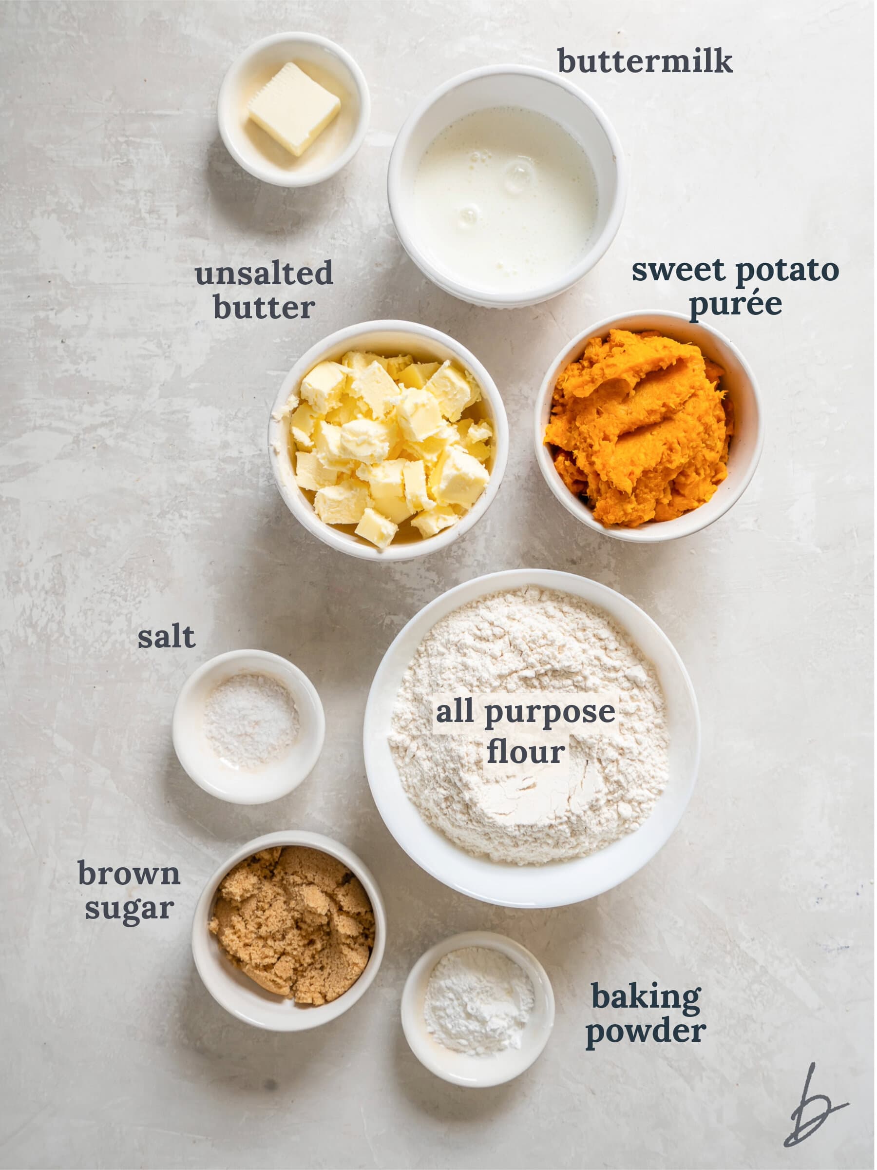 bowls of ingredients to make sweet potato biscuits.